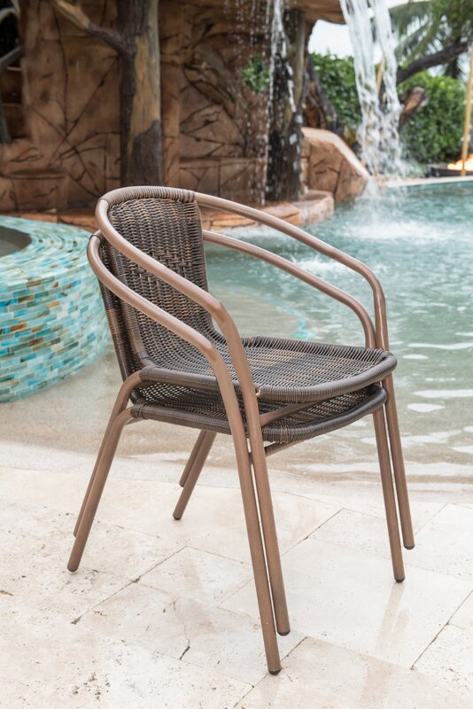 stackable outdoor chairs by the pool