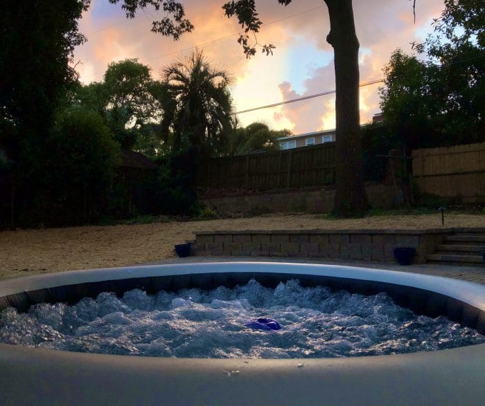 Inflatable hot tub with sunset in background