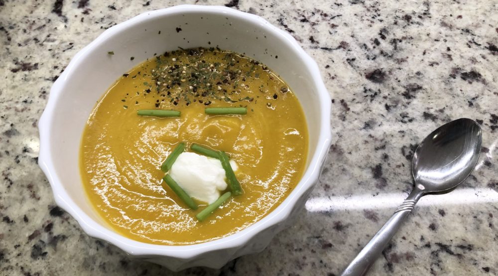 Butternut squash soup decorated to look like Trump