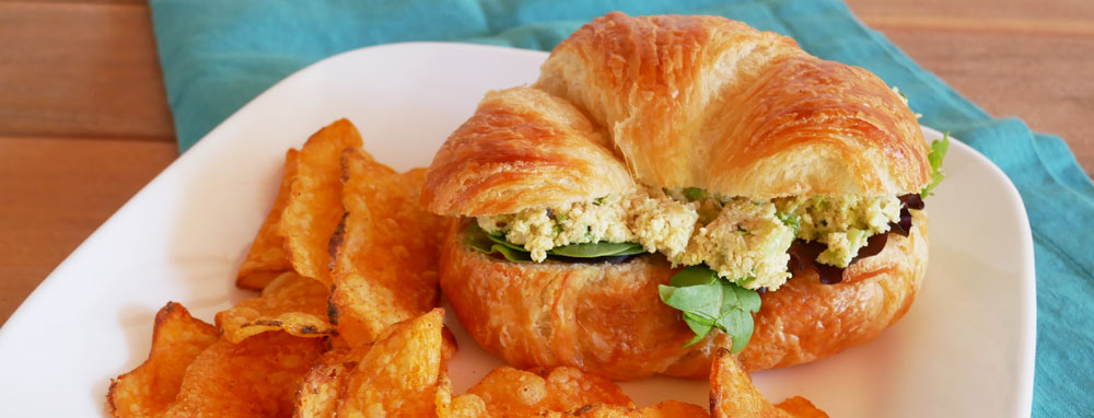 Mock chicken salad sandwich on a croissant