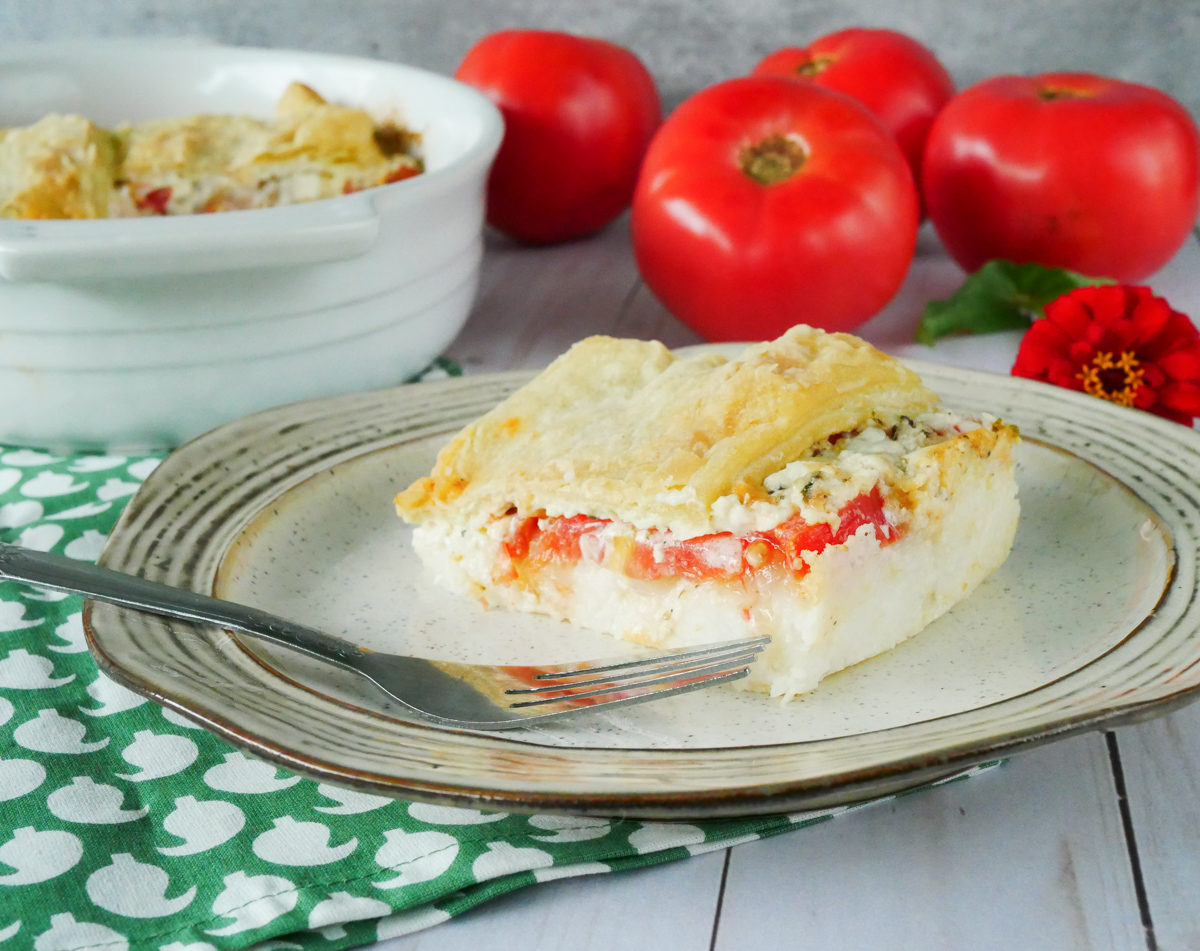 https://theaprilblake.com/wp-content/uploads/2021/08/grits-casserole-with-tomatoes.jpg