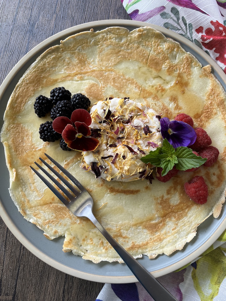 flowers on goat cheese on dutch pancake