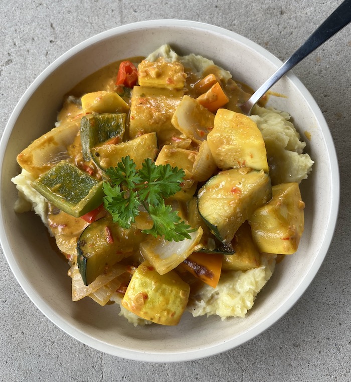 yellow curry stir fry over mashed potatoes