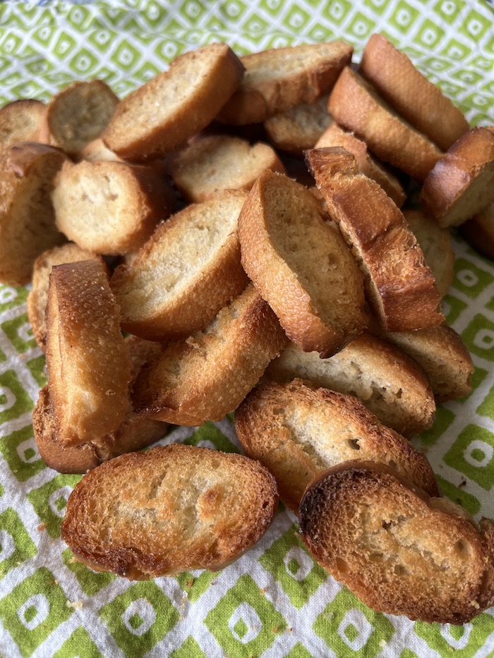 baked sliced baguette crostini