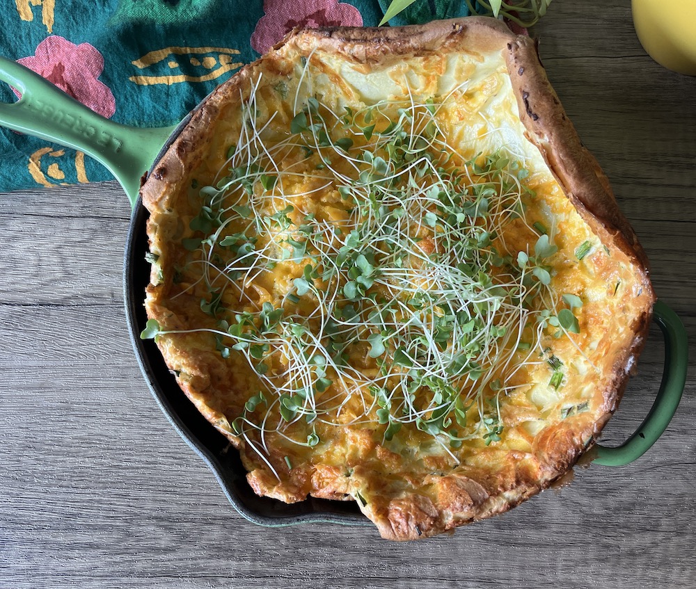 savory dutch baby with microgreens